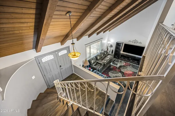 a view of entryway with a floor and front door