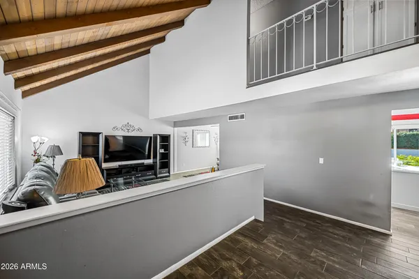 a living room with furniture and a rug