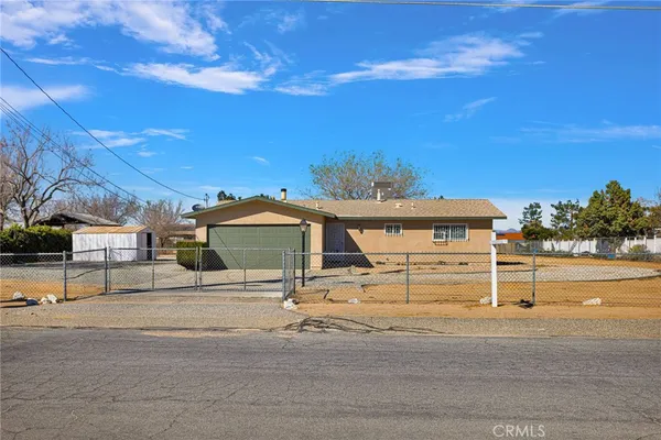 a view of a house with a street