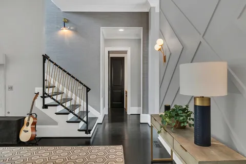 a living room with furniture and flowers