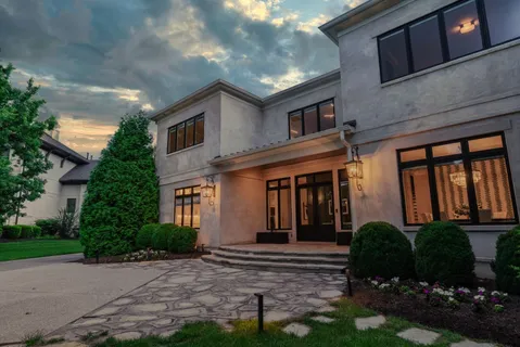 a front view of a house with garden