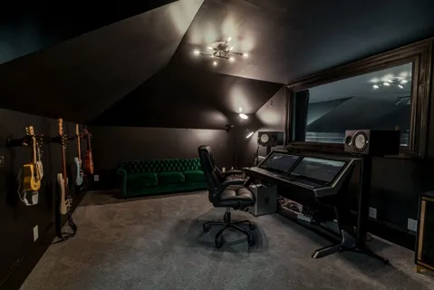 a projector room with furniture and air hockey table