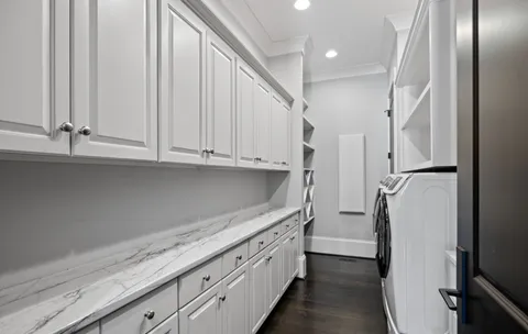 a view of a patio with a table and chairs