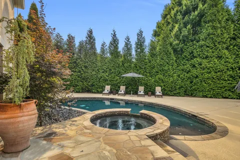 a view of swimming pool with outdoor seating