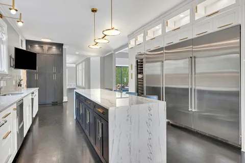 a large kitchen with a large counter top