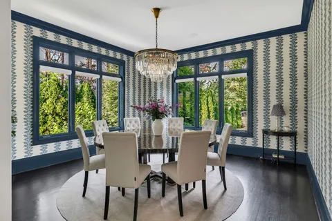 a dining room with furniture window wooden floor