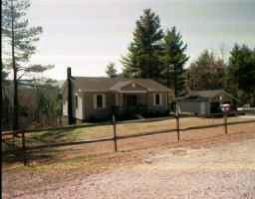 a view of a house with a street