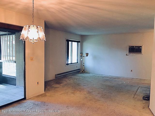 97 Arrowood Road, Unit K Manalapan, NJ 07726 - Photo 5 of 10 Living Room/Dining Room
