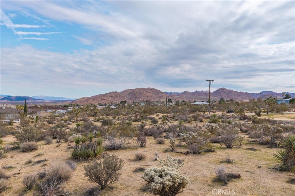 7032 Saddleback Road Joshua Tree, CA 92252 - Photo 17 of 40 a view of a city with mountains in the background