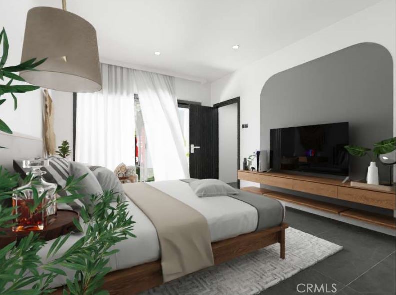 7032 Saddleback Road Joshua Tree, CA 92252 - Photo 9 of 40 a bedroom with a bed and a flat screen tv