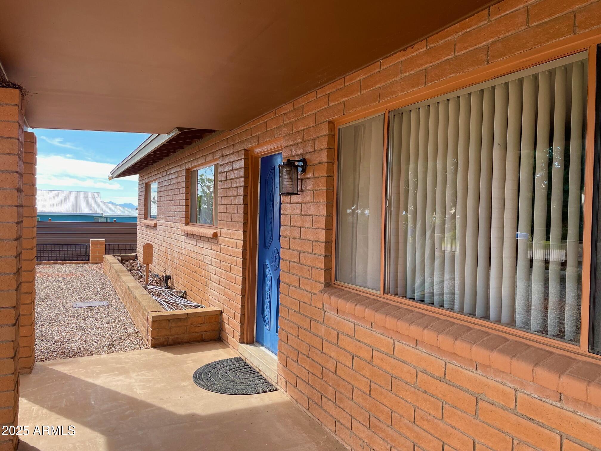 110 Nighthawk Avenue Bisbee, AZ 85603 - Photo 11 of 56 a view of a porch with a table and chairs