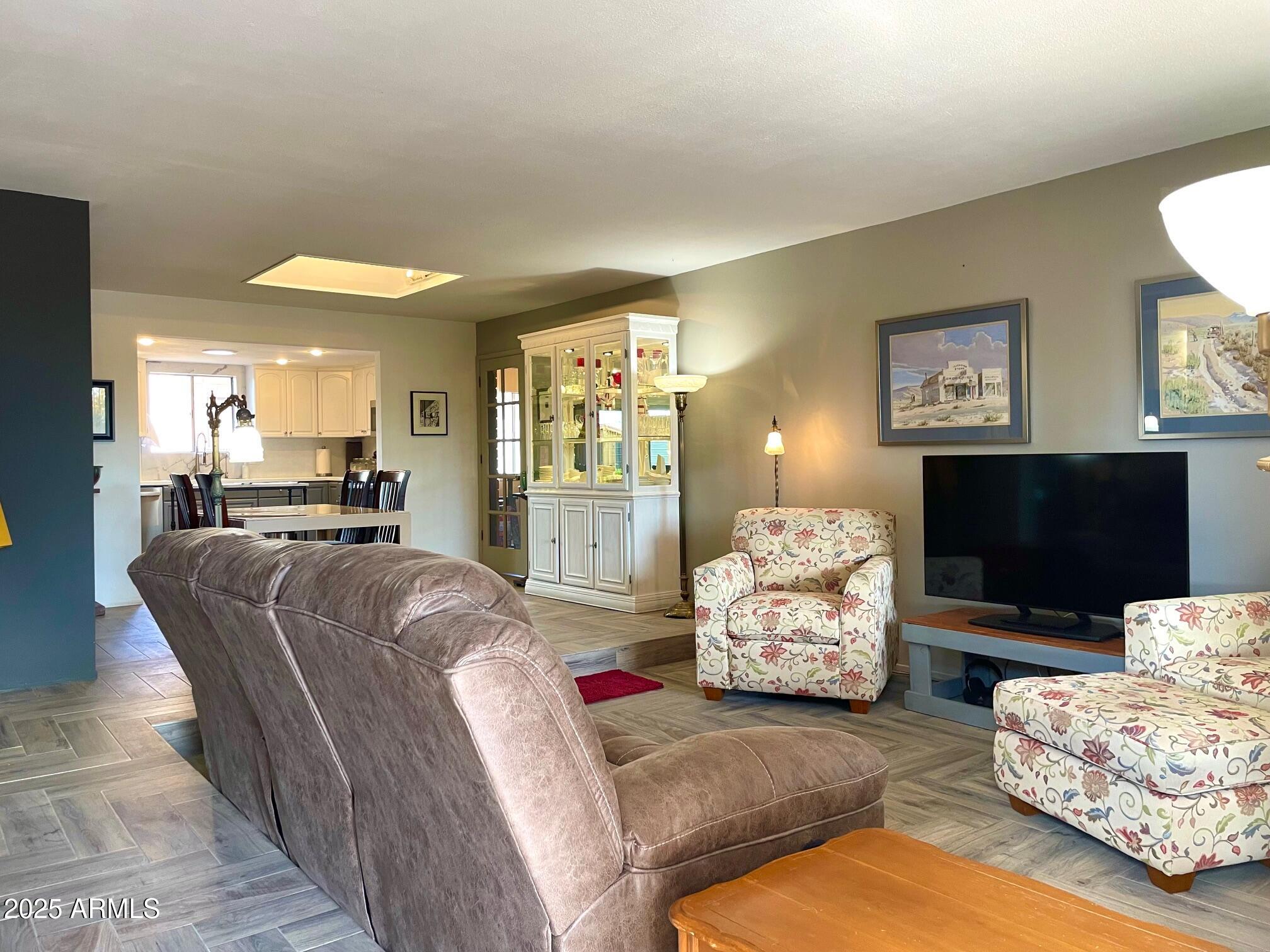 110 Nighthawk Avenue Bisbee, AZ 85603 - Photo 12 of 56 a living room with furniture and a flat screen tv