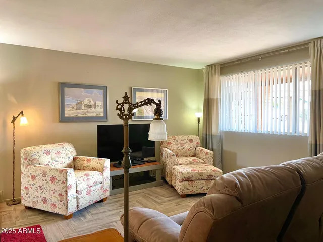 a living room with furniture and a window