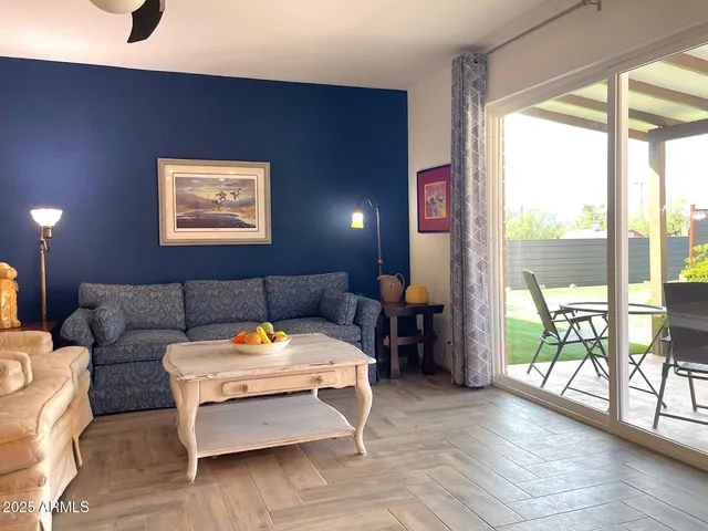 a living room with furniture and a window