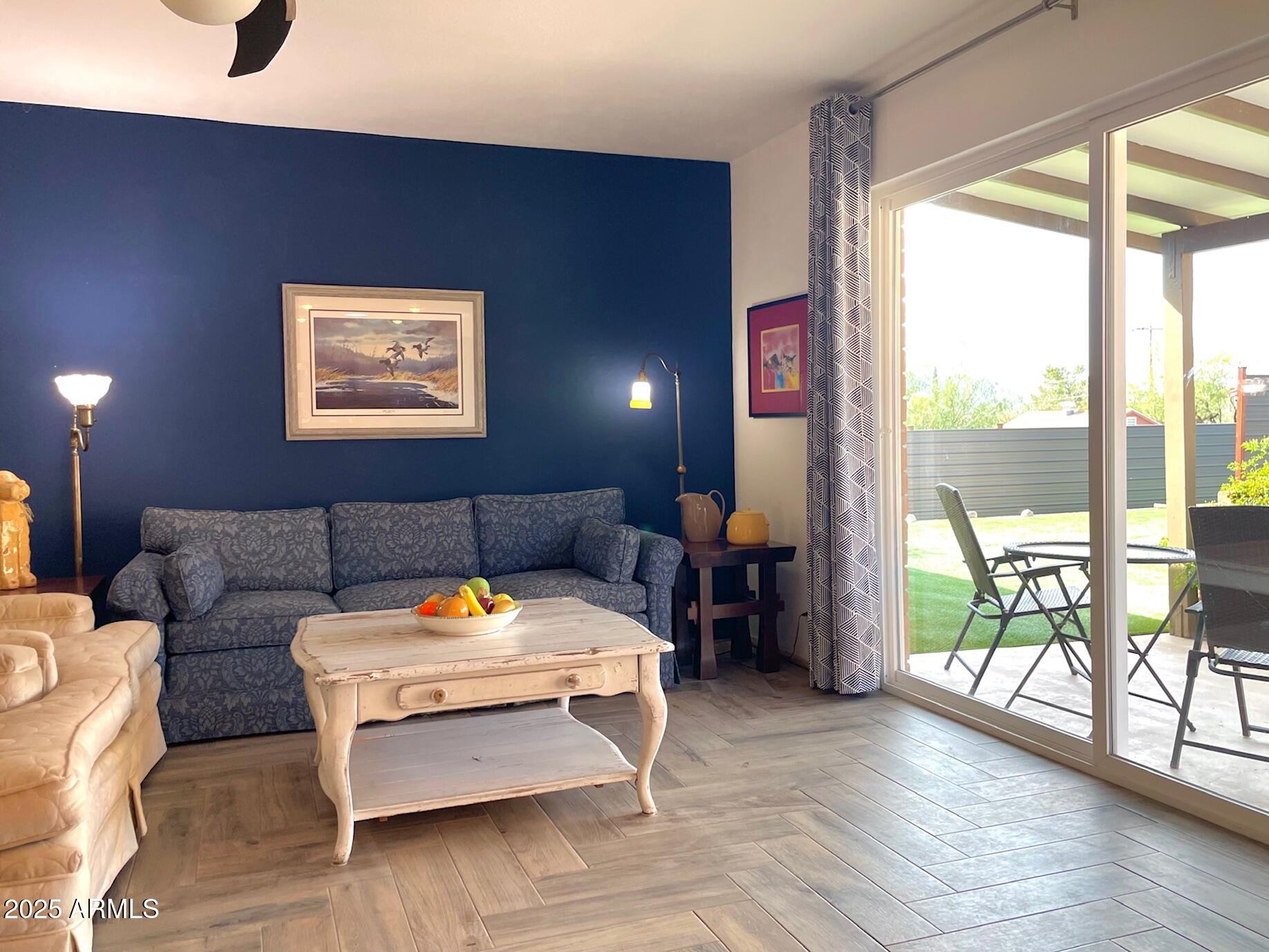 110 Nighthawk Avenue Bisbee, AZ 85603 - Photo 21 of 56 a living room with furniture and a floor to ceiling window