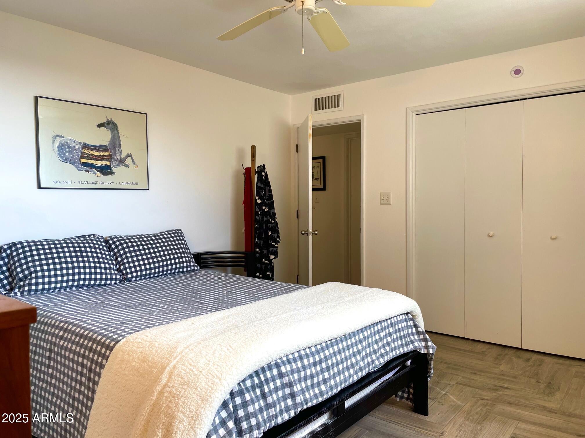 110 Nighthawk Avenue Bisbee, AZ 85603 - Photo 26 of 56 a bedroom with a bed and a painting on the wall