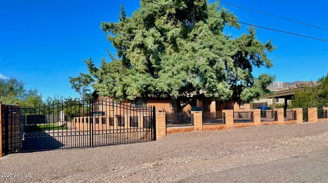 a view of a house with a small yard and plant