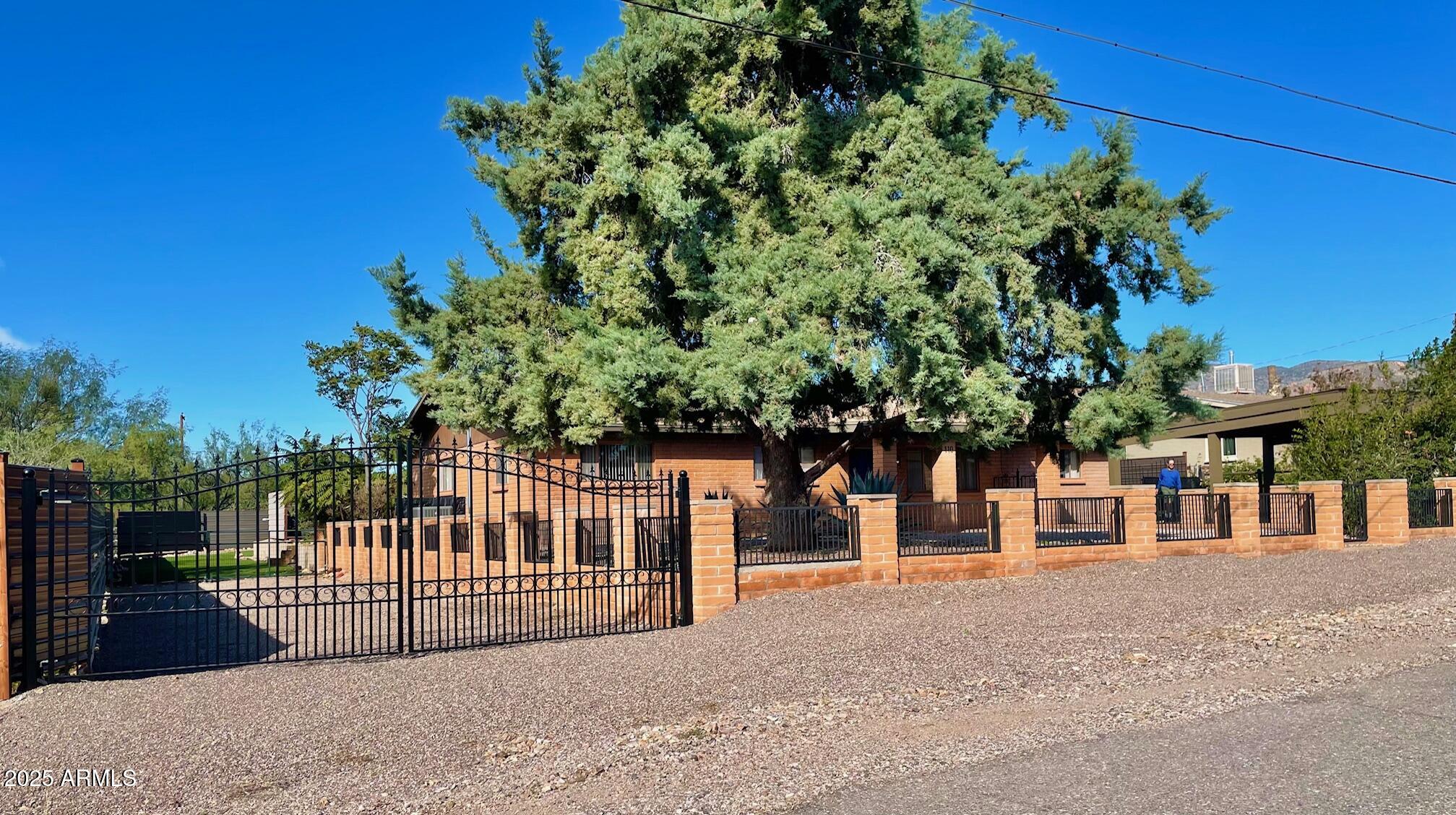 110 Nighthawk Avenue Bisbee, AZ 85603 - Photo 3 of 56 a view of a house with a small yard and plant