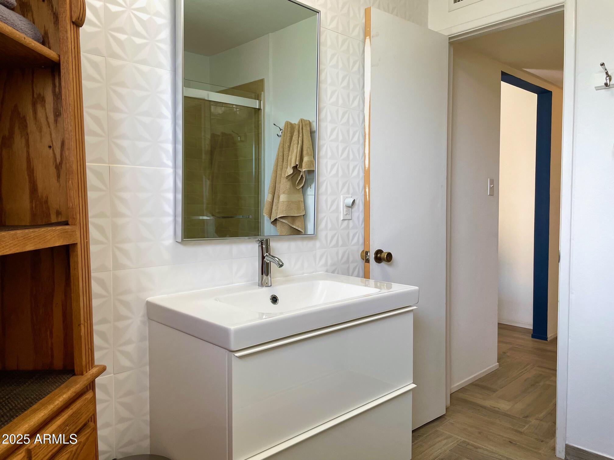 110 Nighthawk Avenue Bisbee, AZ 85603 - Photo 34 of 56 a bathroom with a sink and a mirror