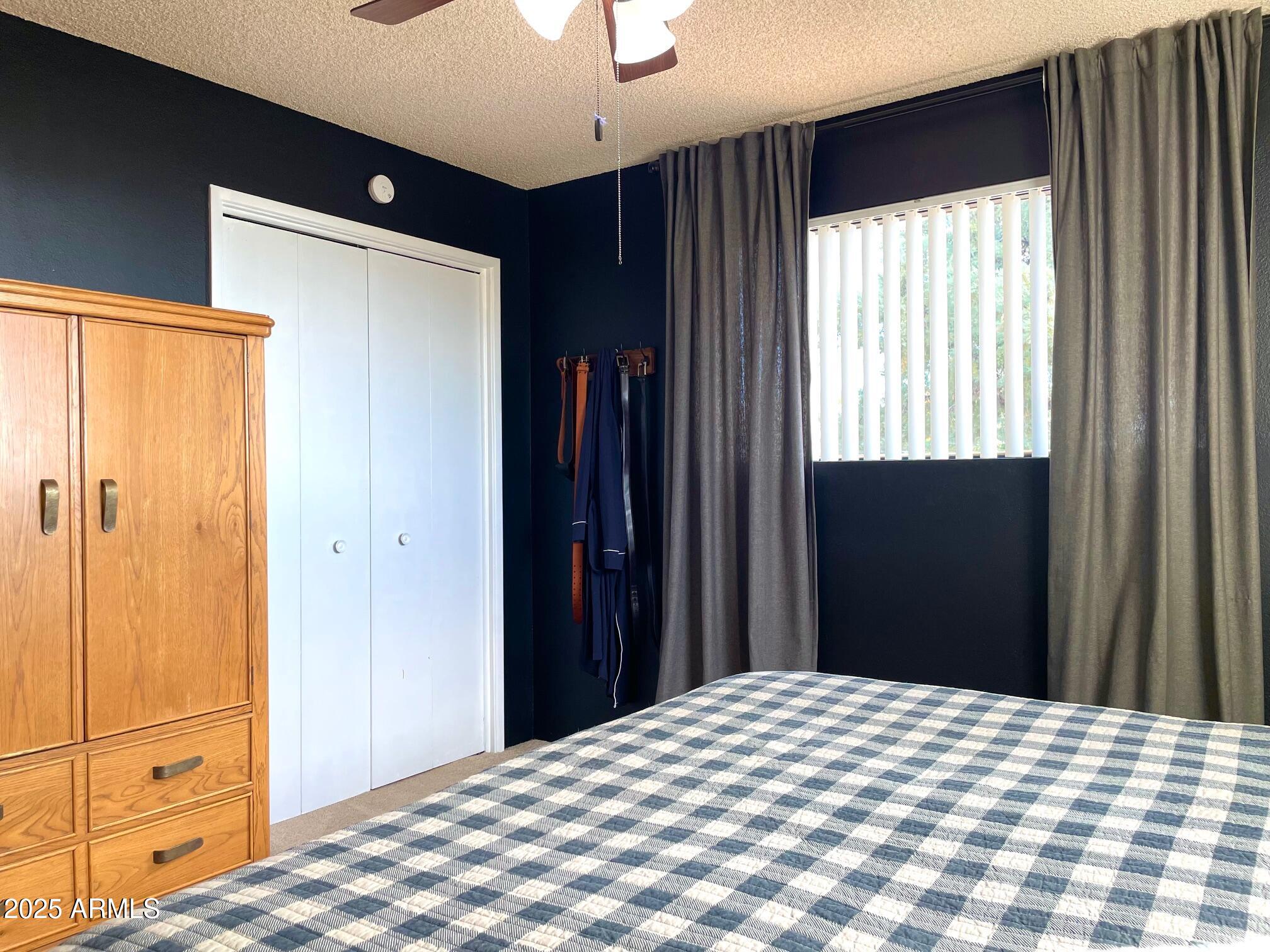 110 Nighthawk Avenue Bisbee, AZ 85603 - Photo 36 of 56 a bedroom with a bed and a window