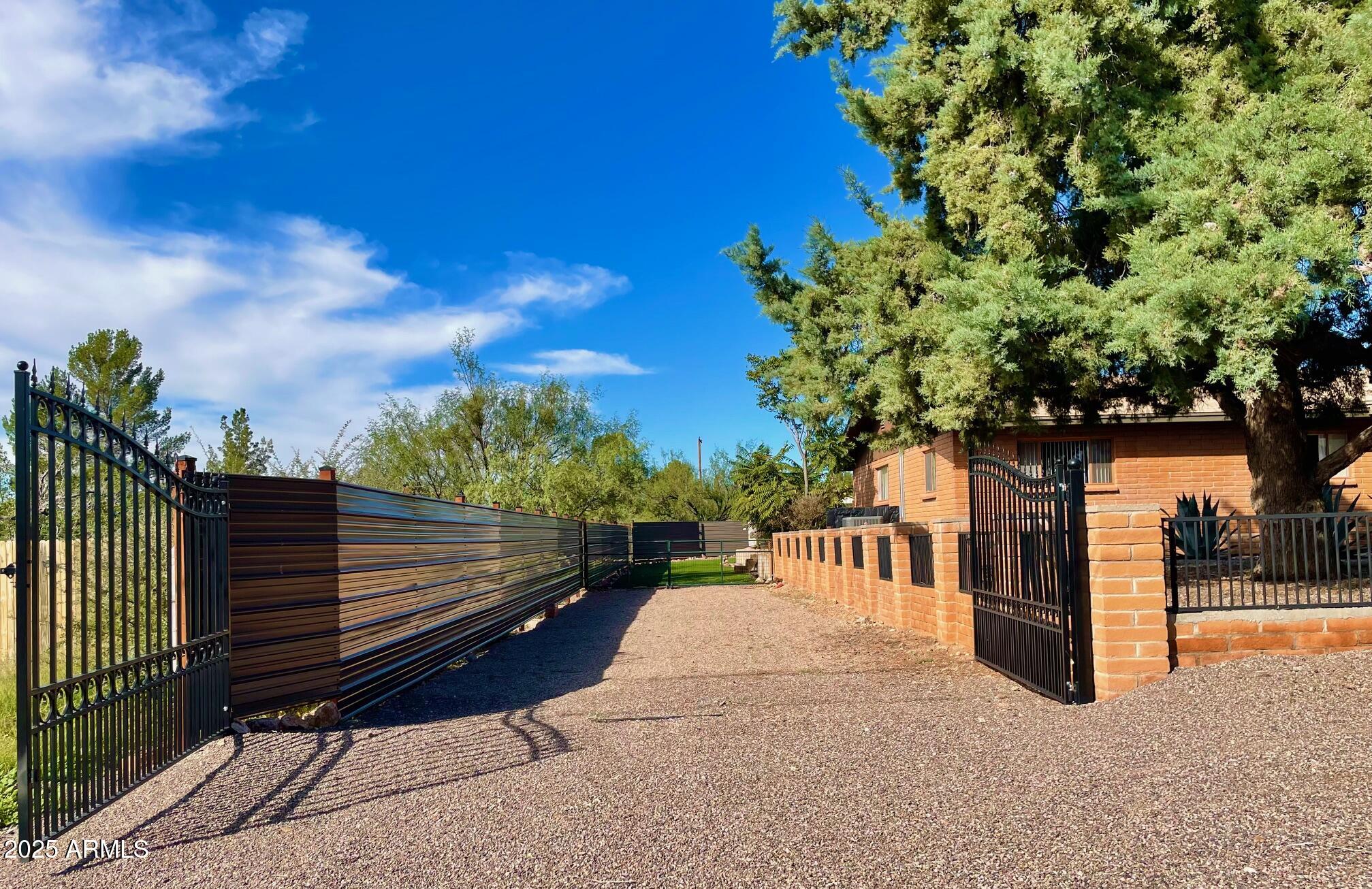 110 Nighthawk Avenue Bisbee, AZ 85603 - Photo 4 of 56 a view of a bench in the roof deck with wooden fence