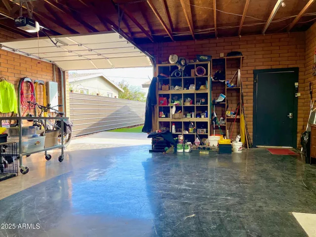 a view of a yard with plants and trees