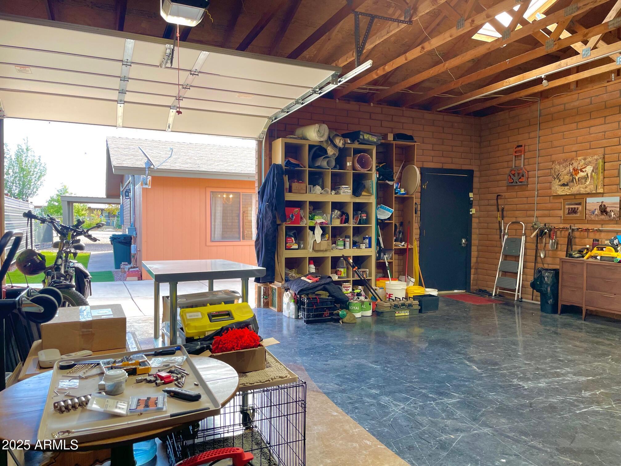 110 Nighthawk Avenue Bisbee, AZ 85603 - Photo 49 of 56 a workspace with furniture fire place and a chandelier