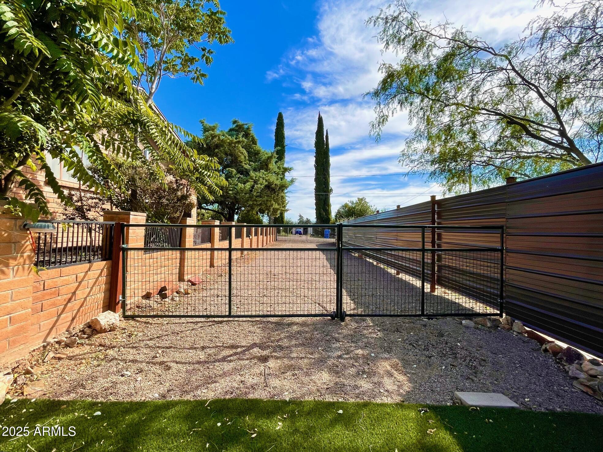 110 Nighthawk Avenue Bisbee, AZ 85603 - Photo 5 of 56 a view of a yard with wooden fence