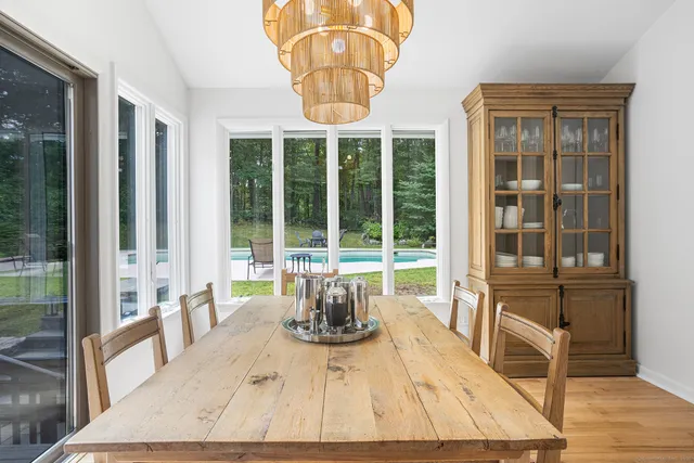 a living room filled with furniture hardwood floor and a large window