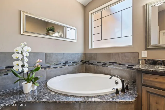 a bathroom with a shower and a sink