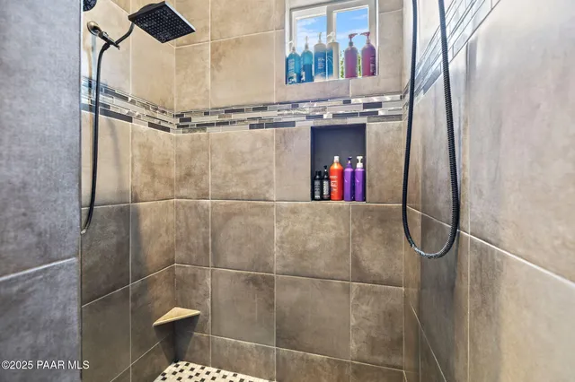 a bathroom with a toilet a sink and a mirror