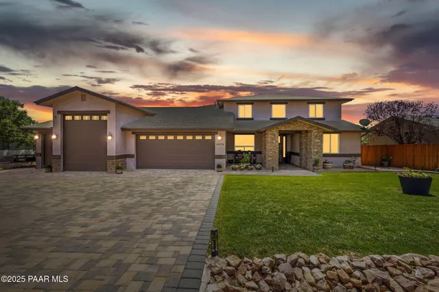 a view of a hallway with wooden floor and entryway