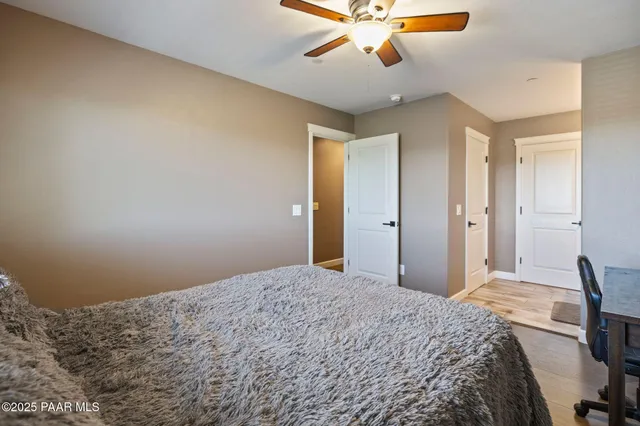a living room with furniture and potted plant