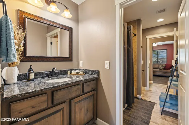 a bed room with a bed and a chair