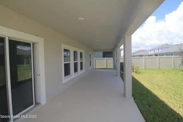 a view of balcony with furniture