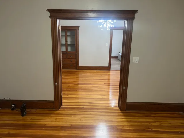 a view of hallway with chandelier
