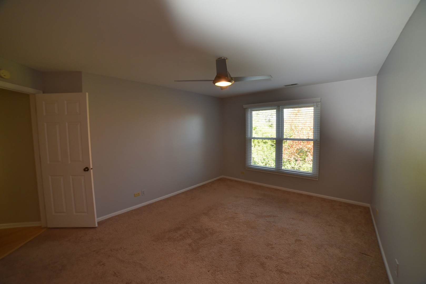2545 Live Oak Lane Buffalo Grove, IL 60089 - Photo 11 of 21 an empty room with ceiling fan and windows