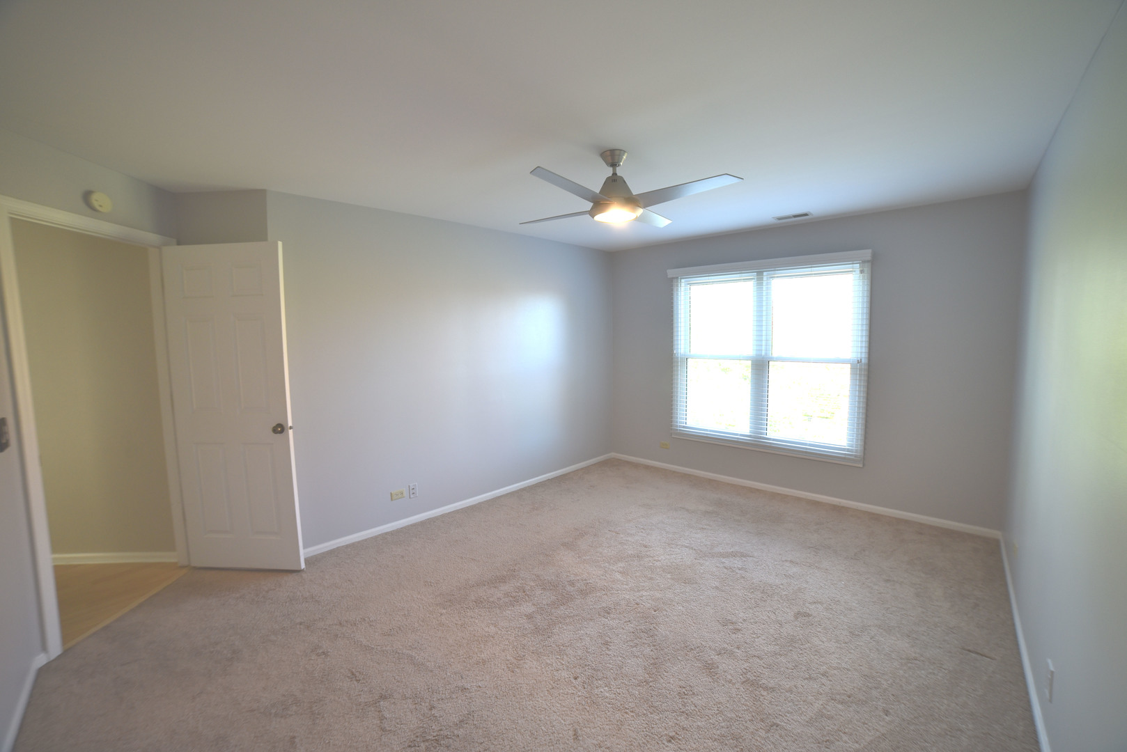 2545 Live Oak Lane Buffalo Grove, IL 60089 - Photo 13 of 21 an empty room with a window and a fan
