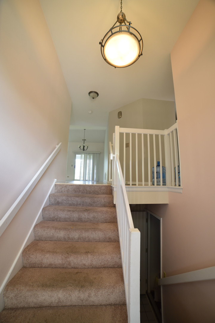 2545 Live Oak Lane Buffalo Grove, IL 60089 - Photo 2 of 21 a view of staircase with railing and white walls