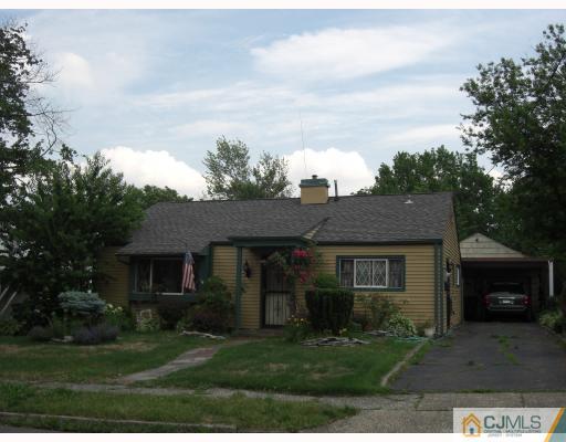36 Winthrop Road Edison, NJ 08817 - Photo 1 of 1 a front view of a house with a garden and yard