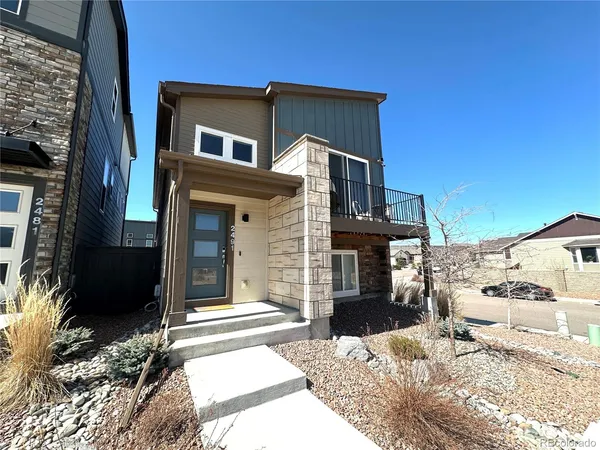 a front view of a house with a rug