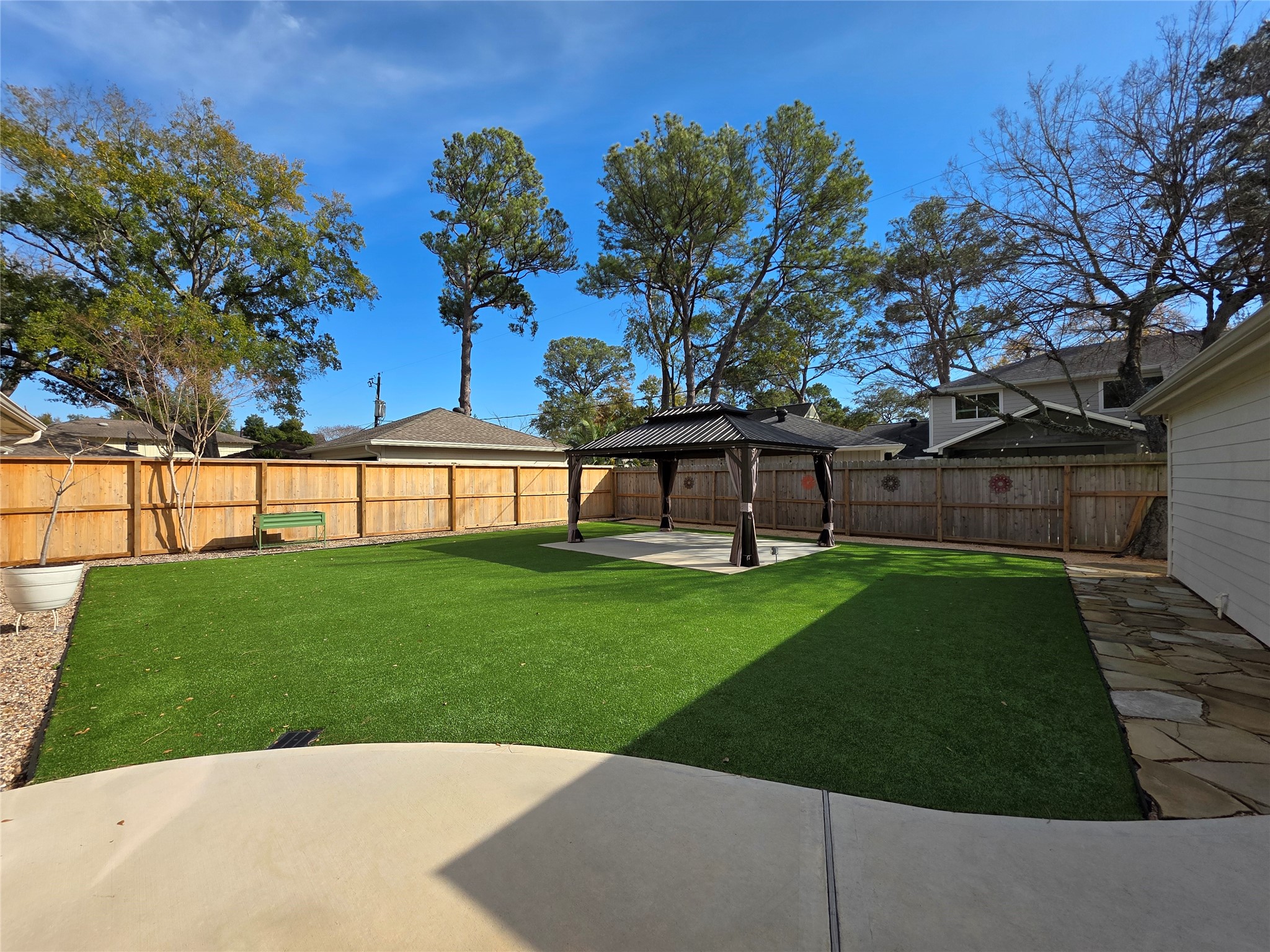 11219 Valley Spring Drive Houston, TX 77043 - Photo 21 of 31 Beautifully maintained backyard with a gazebo. The turf grass looks astonishing and low maintenance!