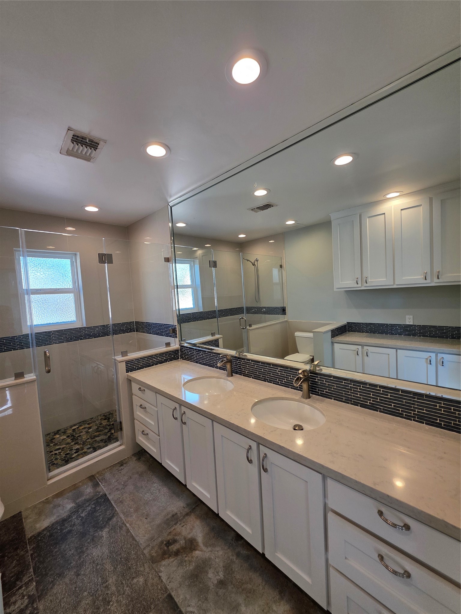 11219 Valley Spring Drive Houston, TX 77043 - Photo 7 of 31 Primary bathroom with shower and dual sinks. Lots of cabinet space!