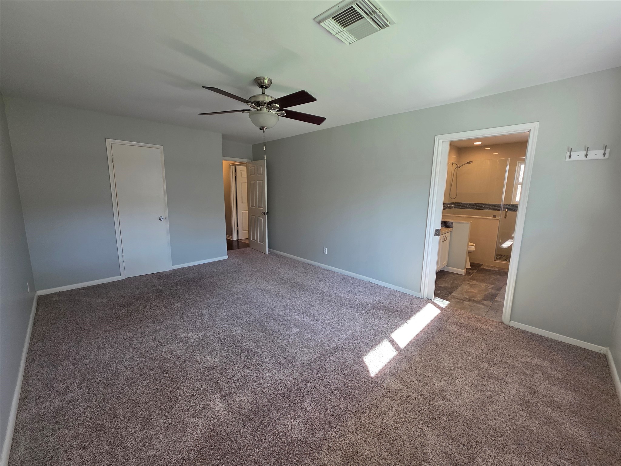 11219 Valley Spring Drive Houston, TX 77043 - Photo 8 of 31 Another view of the primary bedroom with walk in closet and an ensuit bathroom