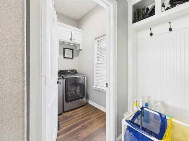 a view of utility room with a ceiling fan