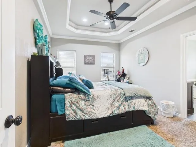 a bedroom with bed and a window