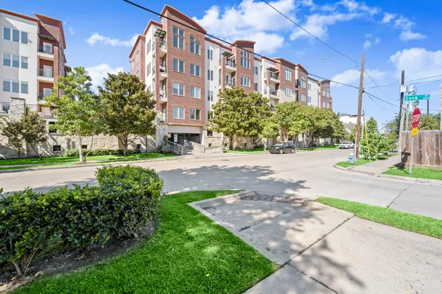 a view of a building with a yard