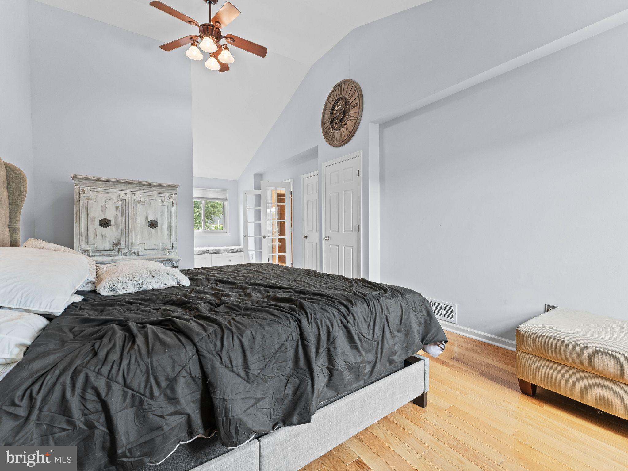 8 Chesterfield Road Sewell, NJ 08080 - Photo 23 of 57 a bedroom with a bed and a chandelier