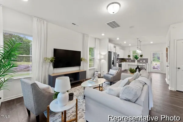 a living room with furniture and a flat screen tv