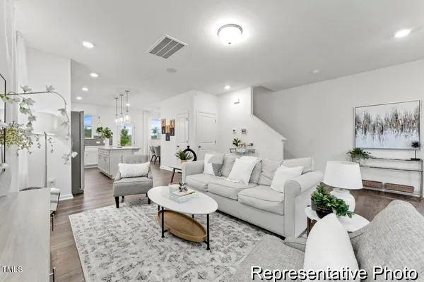 a living room with furniture and a table